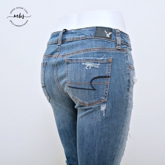 American Eagle Super Stretch Low Waist Distressed Raw Hem Jeggings - Picture 8 of 14